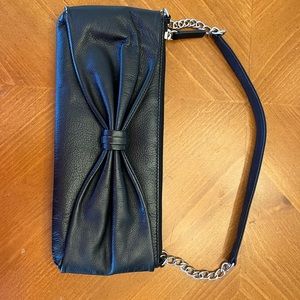 Cute black going out bag with black bow tie in middle